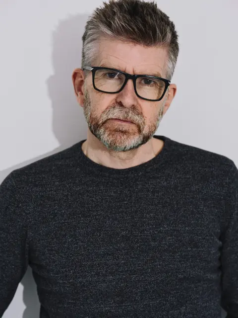 Close studio portrait of Phil Alderson